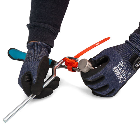 A person using the GrippTie Tool applying a GrippTie to a hammer with gloves on. d